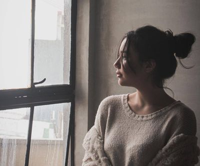 a woman looking out the window.